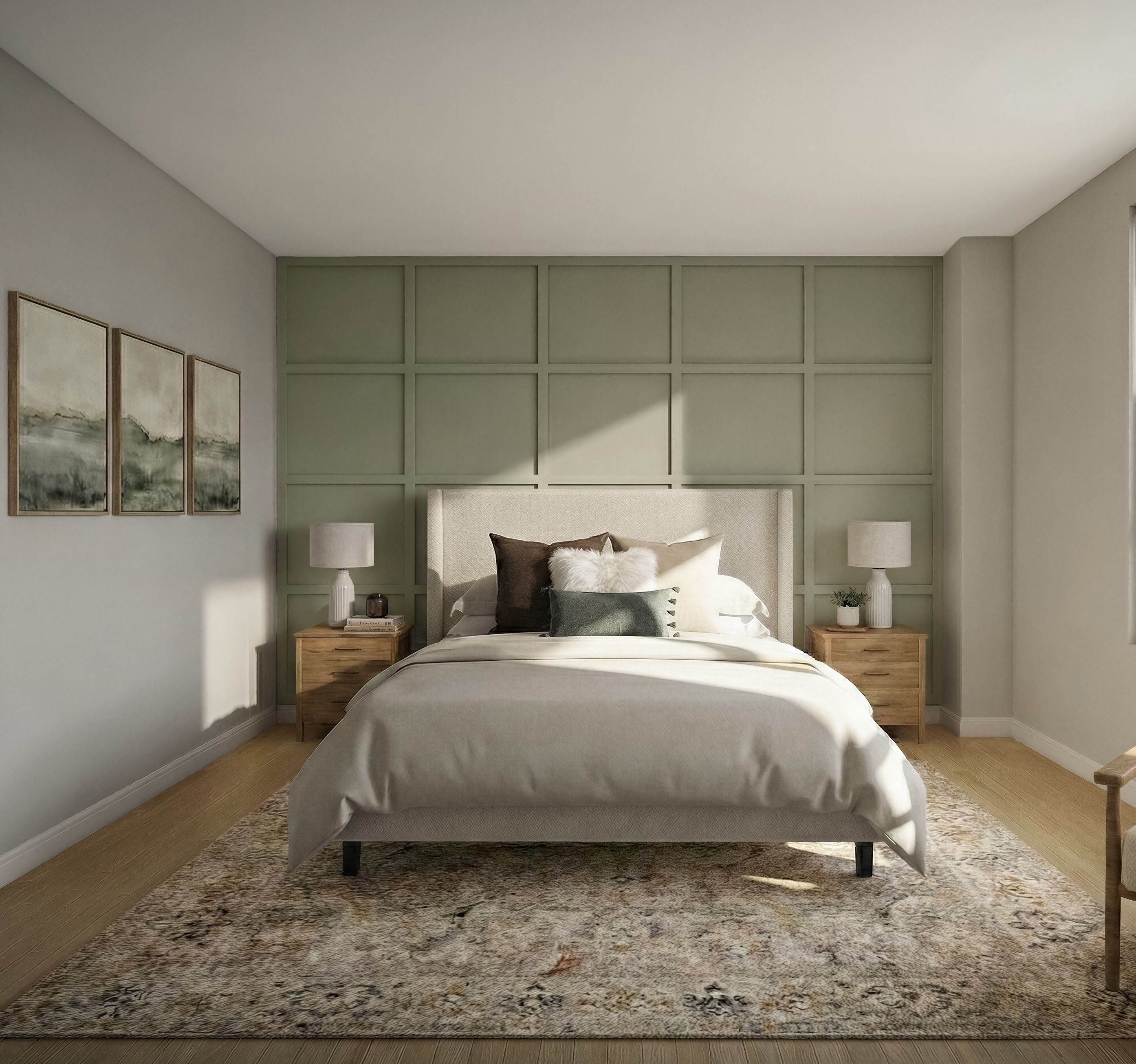 Bedroom with a green paneled accent wall, upholstered bed, and paired framed prints.