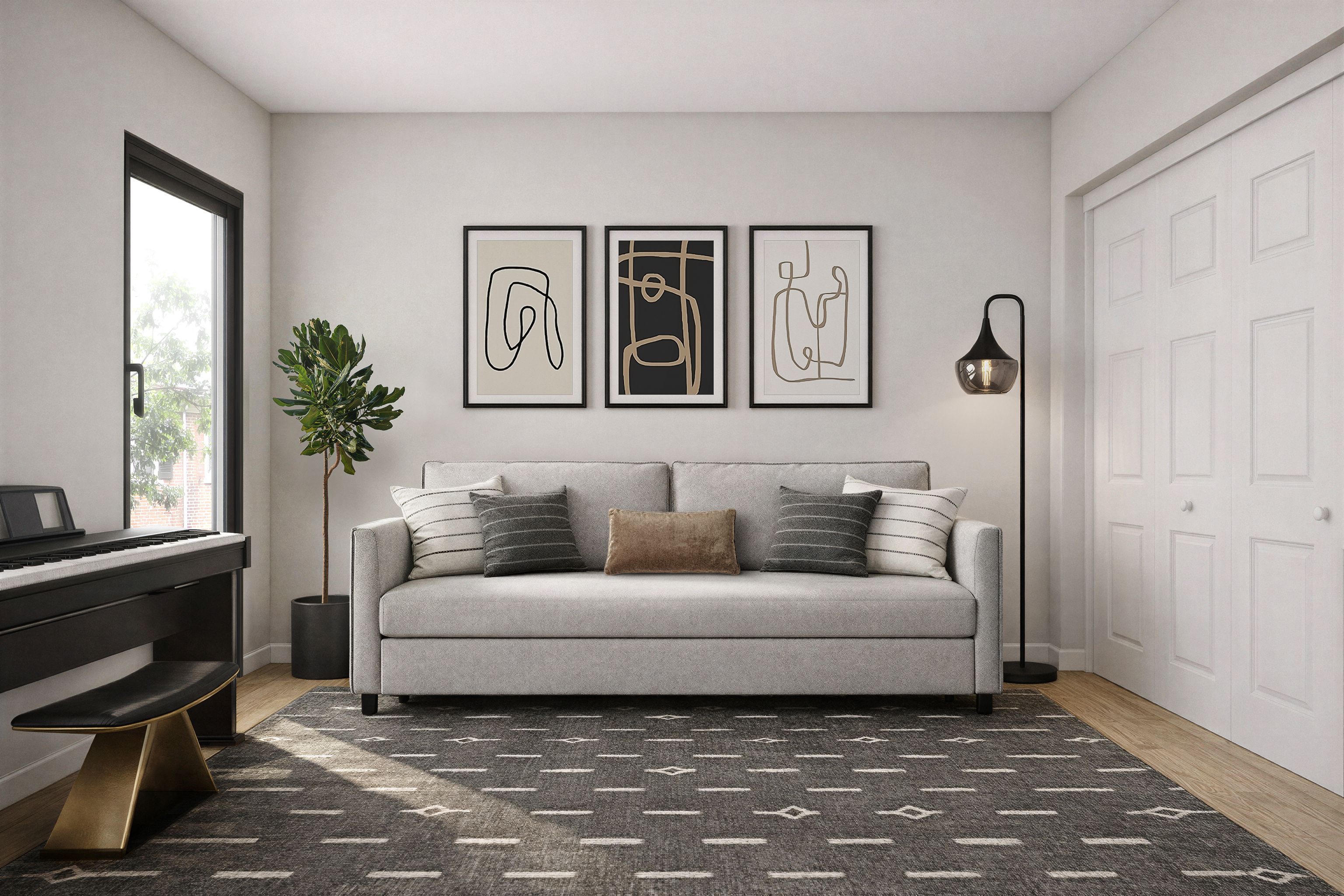 Contemporary guest room with a layered light gray sofa beneath three framed prints, a warm charcoal rug, and a piano.