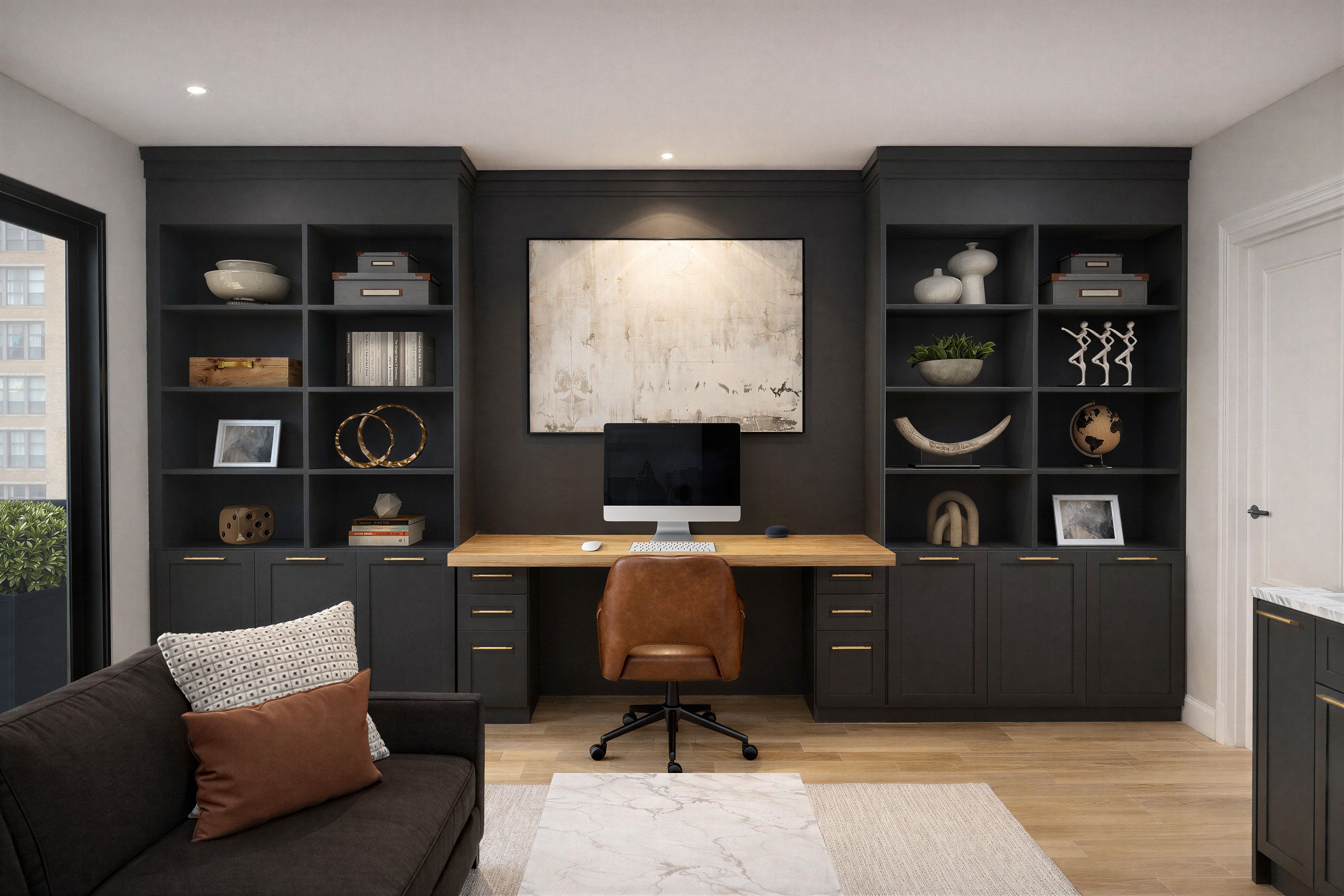 Contemporary home office with dark custom built-in styled shelving surrounding a desk with sitting area.