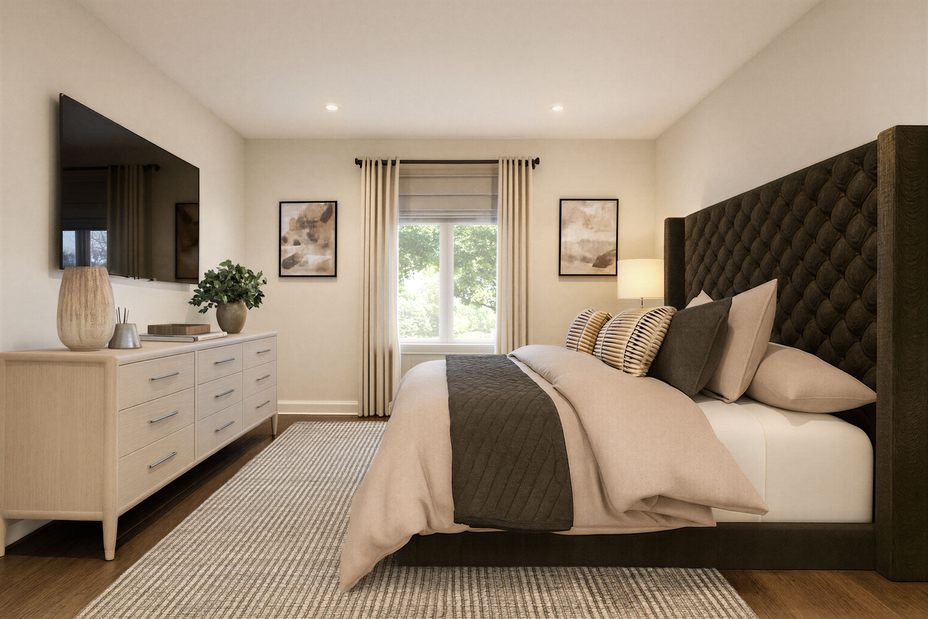 Bedroom with a long dresser beneath a wall-mounted television and an upholstered bed.