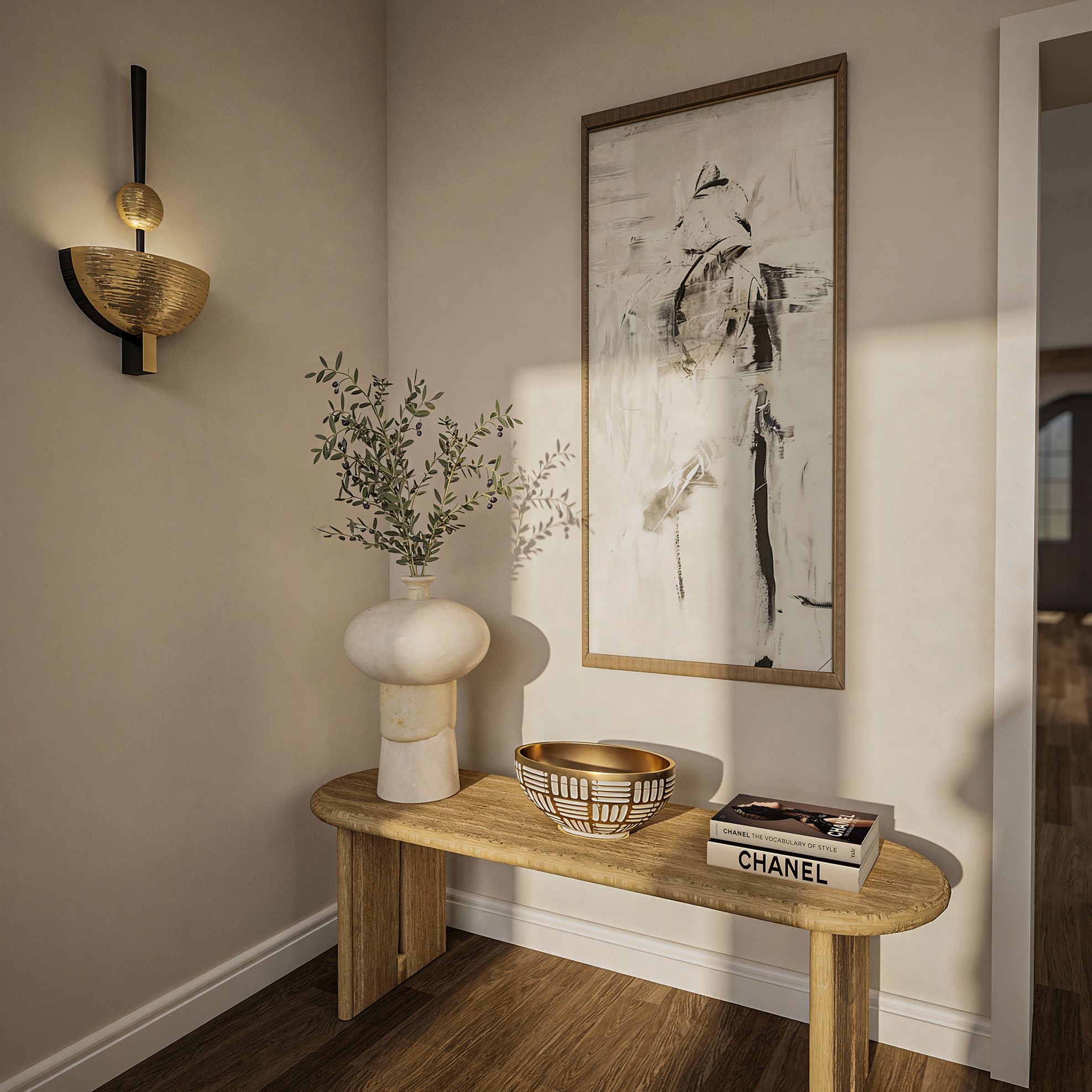 Console table beneath a large framed sketch, styled with a stone lamp and olive branches.
